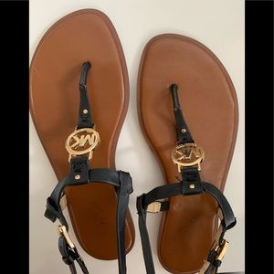 Michael Kors black and gold women’s thong sandals